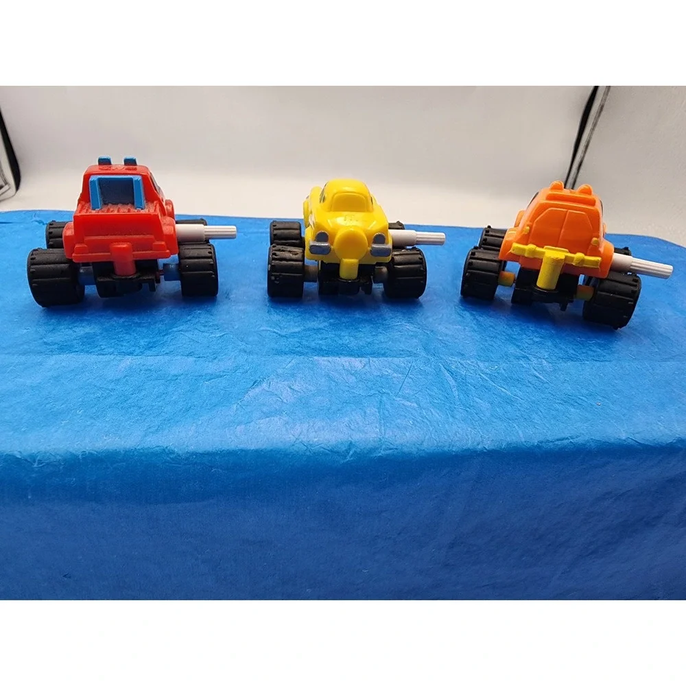Vintage McDonalds Happy Meal Monster Truck Toy Lot Red Yellow Orange Set of 3